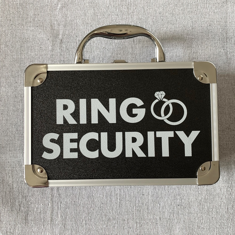 Ring bearer ring security briefcase and earpiece
